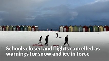 Schools closed and flights cancelled as warnings for snow and ice in force