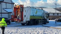 After a while stuck in the snow, Douglas City Council bin men managed to get their truck out in Robert Stephen Close