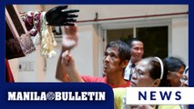 Catholic devotees line up to touch images of Jesus Nazareno at Quiapo Church