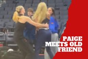 Paige Bueckers surprises an old friend with a playful shove on the court