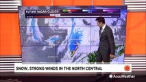 Snow and strong winds sweep across the Great Lakes