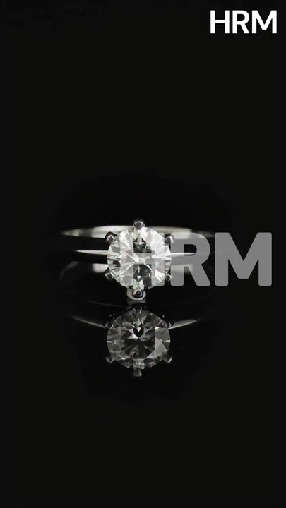 HRM In this project, we took the most iconic engagement ring style—the 6-prong solitaire—and paired it with a bold, hand-faceted white gold band. The result is a stunning contrast between the organic brilliance of the round diamond and the sharp.