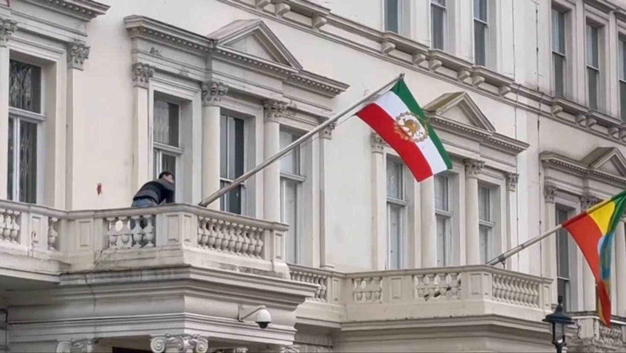 Protester tears down Iranian flag from London embassy