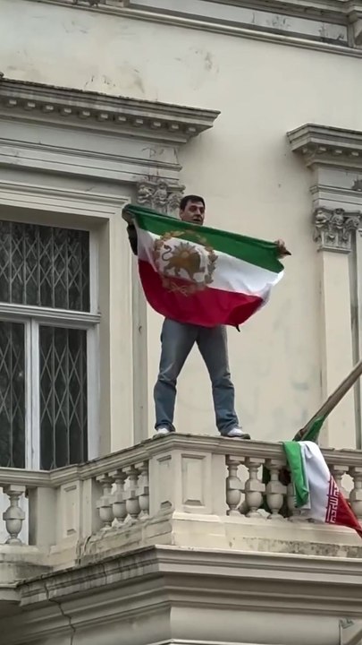 Iranian flag ripped down during protest at London embassy