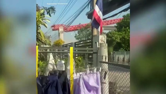 Crane falls on train in Thailand, killing at least 30 and injuring dozens more