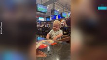Toddler Gets Distracted by a Waitress During Family Meal