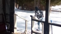 Epic fall: Man slips on ice right outside his home