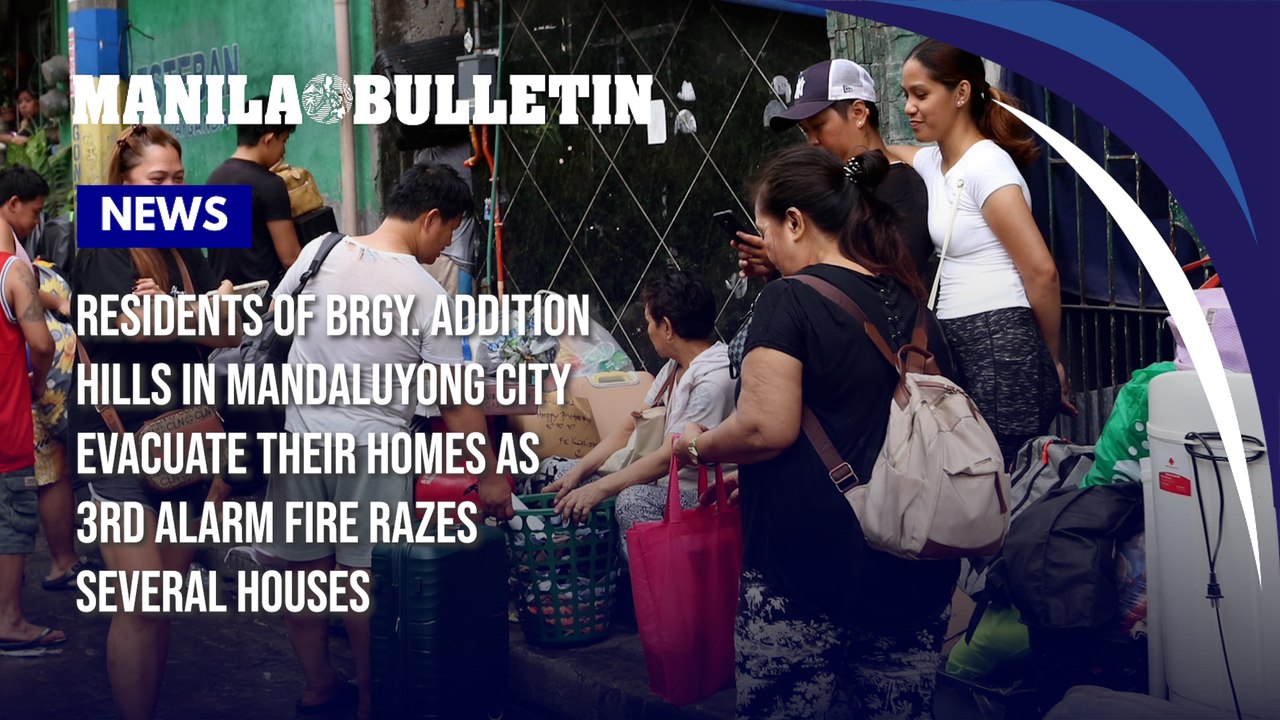 Residents of Brgy. Addition Hills in Mandaluyong City evacuate their homes as 3rd alarm fire razes several houses