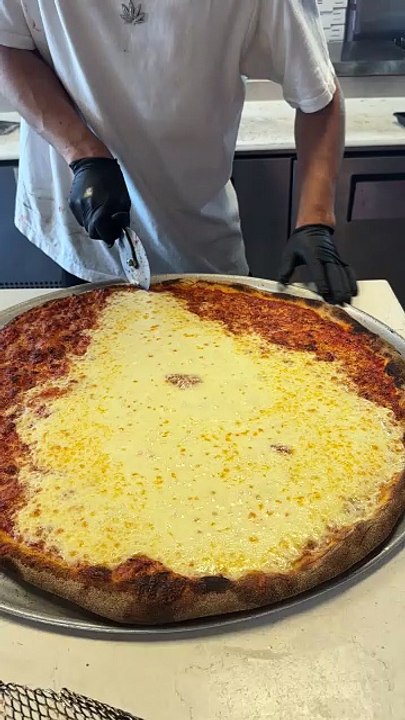 The worlds largest and cheesiest slice
