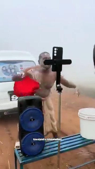 Man dancing shower in winter