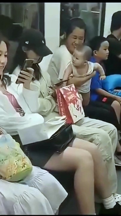 Funny baby in train
