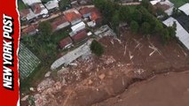 Dramatic drone footage shows homes buried after massive landslide in Indonesia
