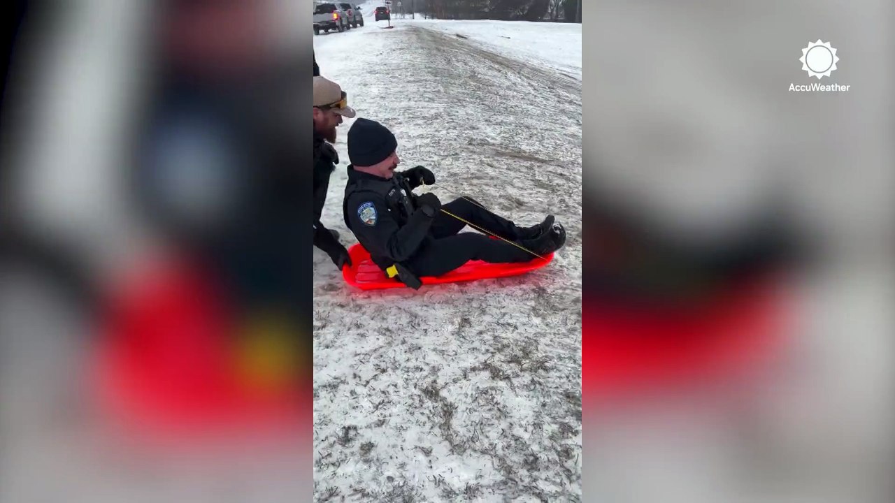 Officer and child tumble in snowy sledding mishap in Jenks