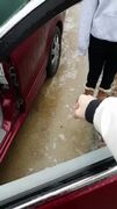 Person Punches Frozen Ice on Car Window and Breaks It