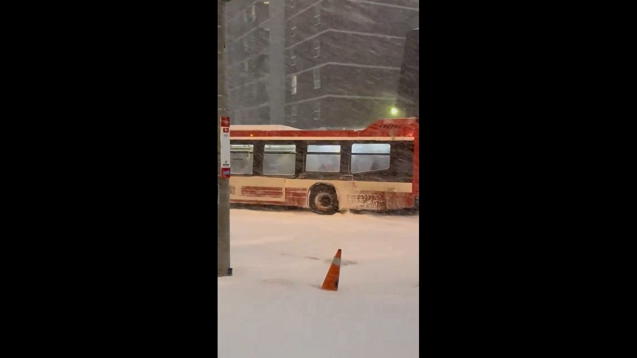 TTC bus struggles through heavy snow during record storm in Toronto, Ontario, Canada