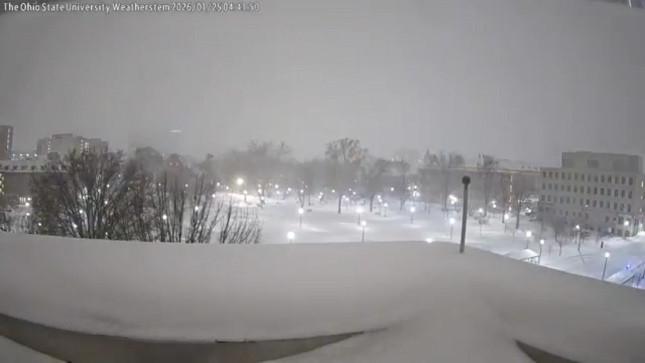 Heavy snow rapidly accumulates at Ohio State University during winter storm in Columbus, Ohio, USA