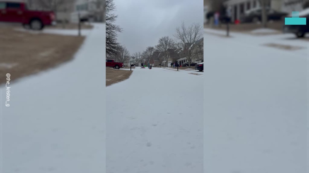 Little Boy on Sled Goes Flying Down Hill With D...