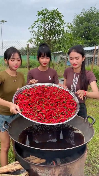 Beautiful young Girls Cook in jungle