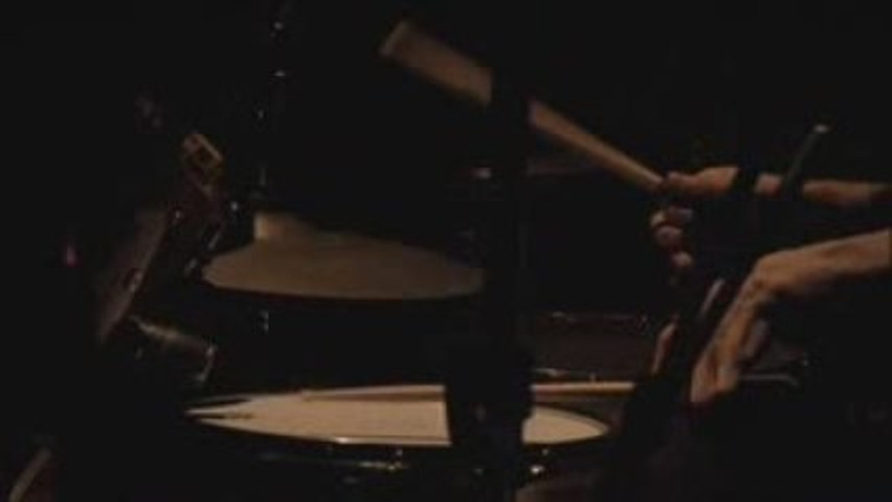 Kai is playing the drums