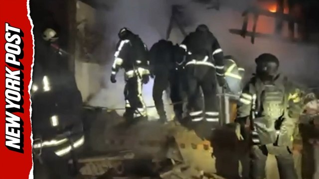 Rescue workers try to retrieve bodies after Russian drone strike kills four, including three children