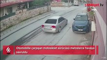Otomobille çarpışan motosiklet sürücüsü metrelerce havaya savruldu