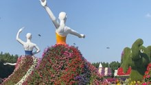 Giant dancing ladies wearing real garden frocks in Dubai