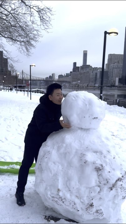 Just as the snowstorm had ended, Nelson Wang, a resident of The Octagon, couldn't wait to go out and play in the snow. On February 23, 2026, on Roosevelt Island in Manhattan.