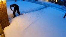 Boy Removes Snow Only for More to Fall on It Again