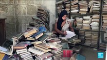 Gazans battle to salvage ancient books in war-ravaged mosque library