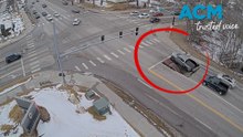 Dramatic moment sinkhole suddenly swallows two cars at intersection