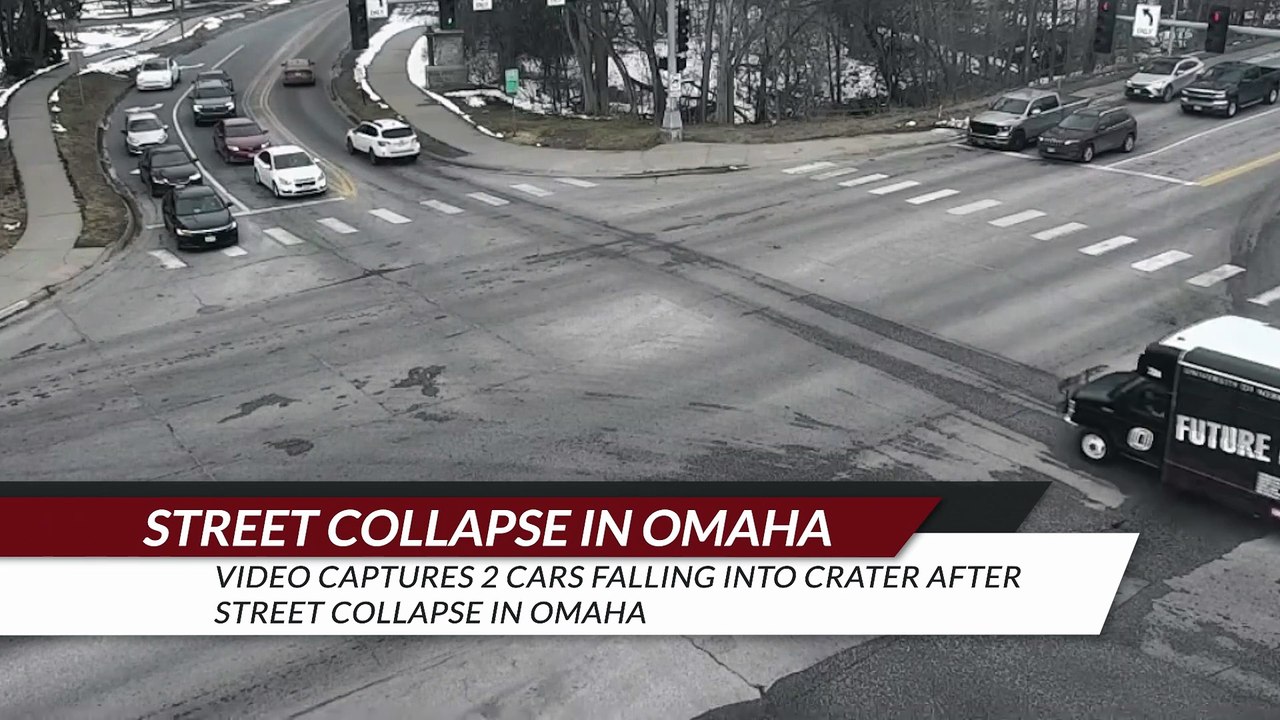 Video captures 2 cars falling into crater after street collapse in Omaha