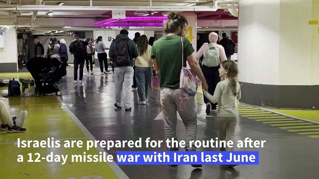 Israelis in Tel Aviv take shelter from Iranian missiles