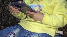 Salar ahmad playing video games on mobile