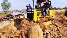 Watch this powerful dump truck and excavator handling extreme muddy road conditions. Heavy equipment operators show real skills while transporting loads through dangerous off-road terrain. Satisfying and intense construction action!