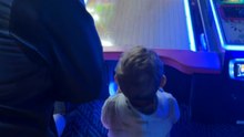 Little kid applauds his own bowling roll at the arcade and comes surprisingly close to a strike