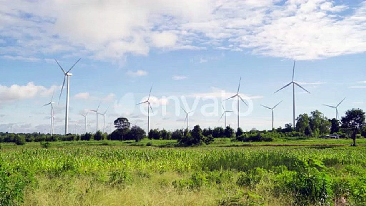 Wind turbines or windmills farm field in industry factory. Power, sustainable green clean energy