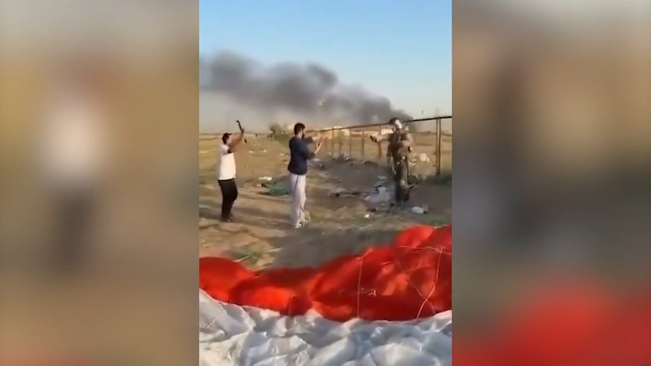 Moment local man threatens downed F-15 pilot with metal pole in Kuwait: 'Back up, I'm American'