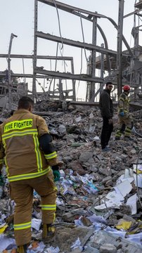 Damaged Buildings, Vehicles Seen After Strikes on Iran