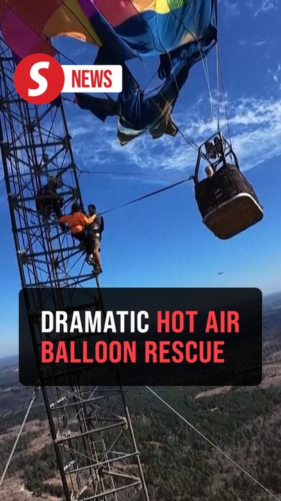 Two rescued from hot air balloon stuck over 280 meters in the air