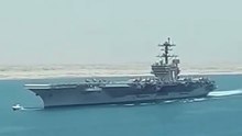 Amateur footage of a US aircraft carrier being attacked by Iranian missiles.