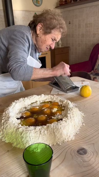 Elderly Woman Kneading Dough To Prepare Delicious Homemade Pasta From Scratch