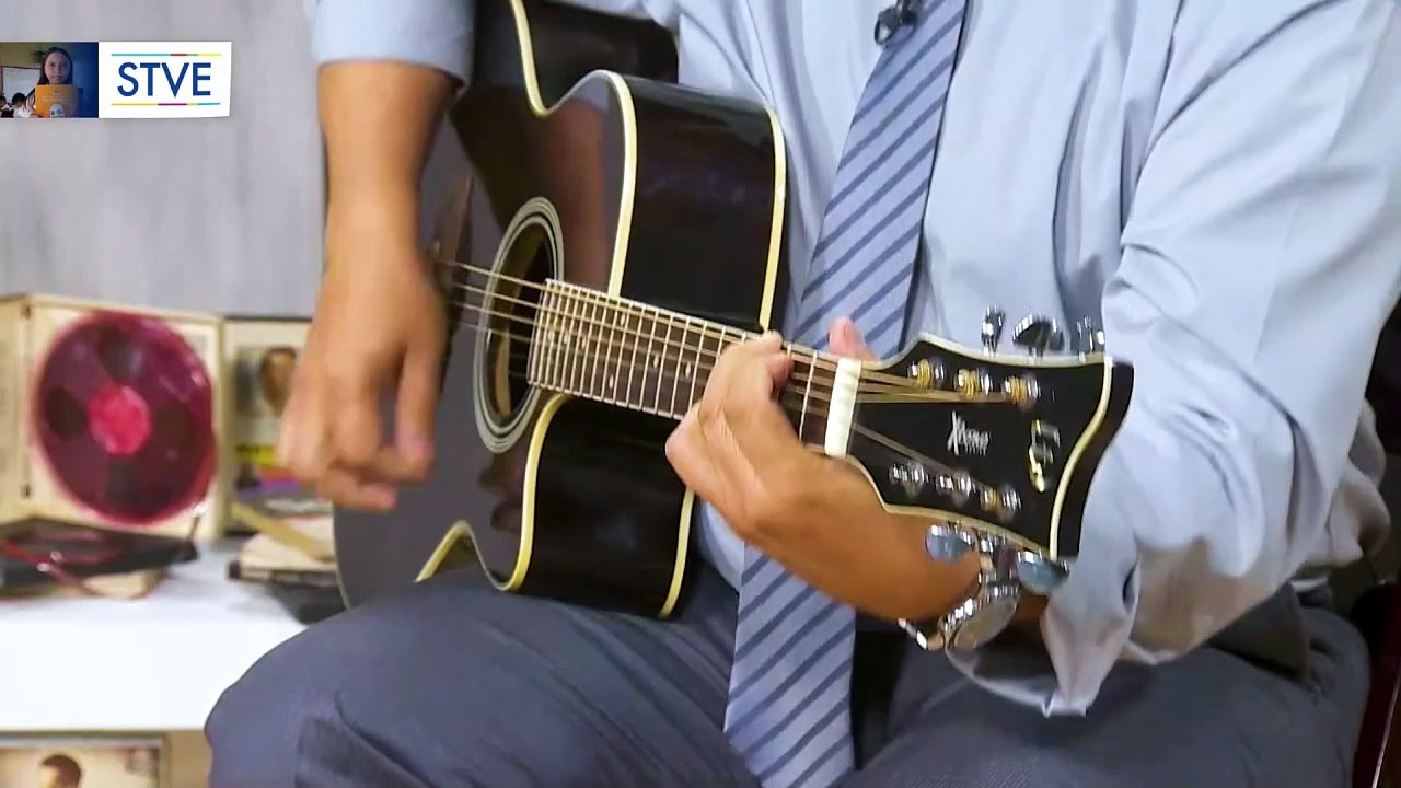Guitarra en mano