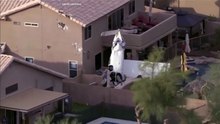 Small plane crashes into two homes in Phoenix, three injured
