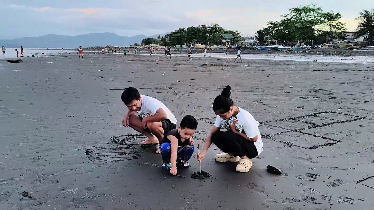 Family Day at the Beach: RG, Nami, and baby Isaiah! 🌊👪