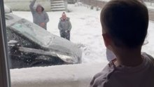 Adorable moment: Toddler believes a snowball hit her head through the glass