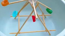 Learn How to Make a Fun Summer Water Windmill Craft for Kids Using Chopsticks and Bottle Caps