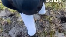 Girl Struggles To Pull Free From Mud Before Slipping Back Into It