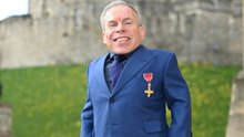 Warwick Davis has revealed Prince William thought he already had an OBE