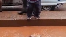 Boy Steps On A Stone To Get Across Water But Falls In It