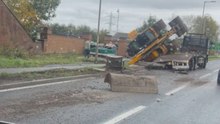 Dramatic aftermath of a digger crash likely caused by an unfolded boom